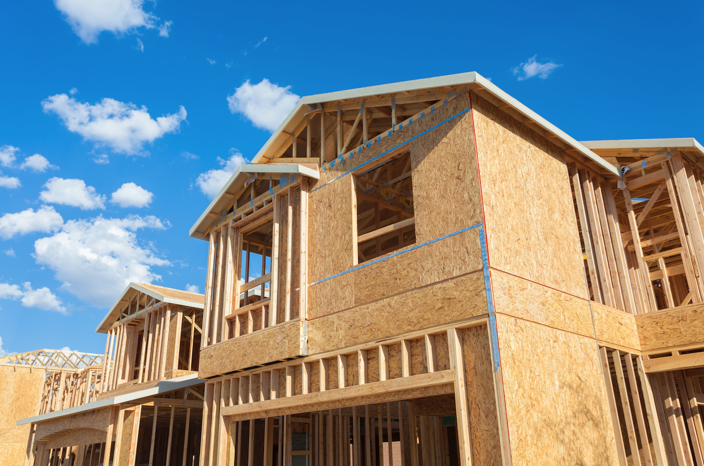 background image of a house being constructed